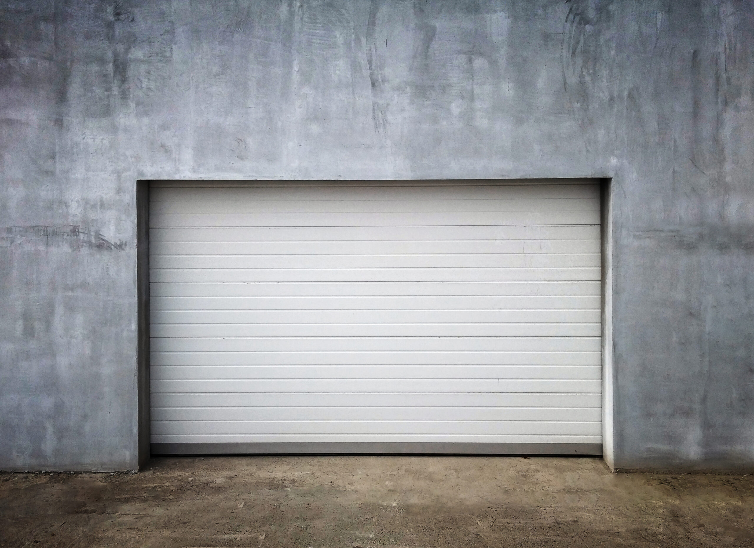 technician performing precision moves commercial garage door services that drive control
