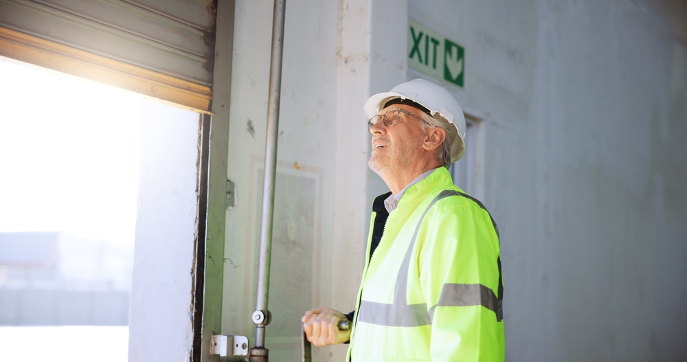 technician performing smart moves for garage door maintenance that last on residential door