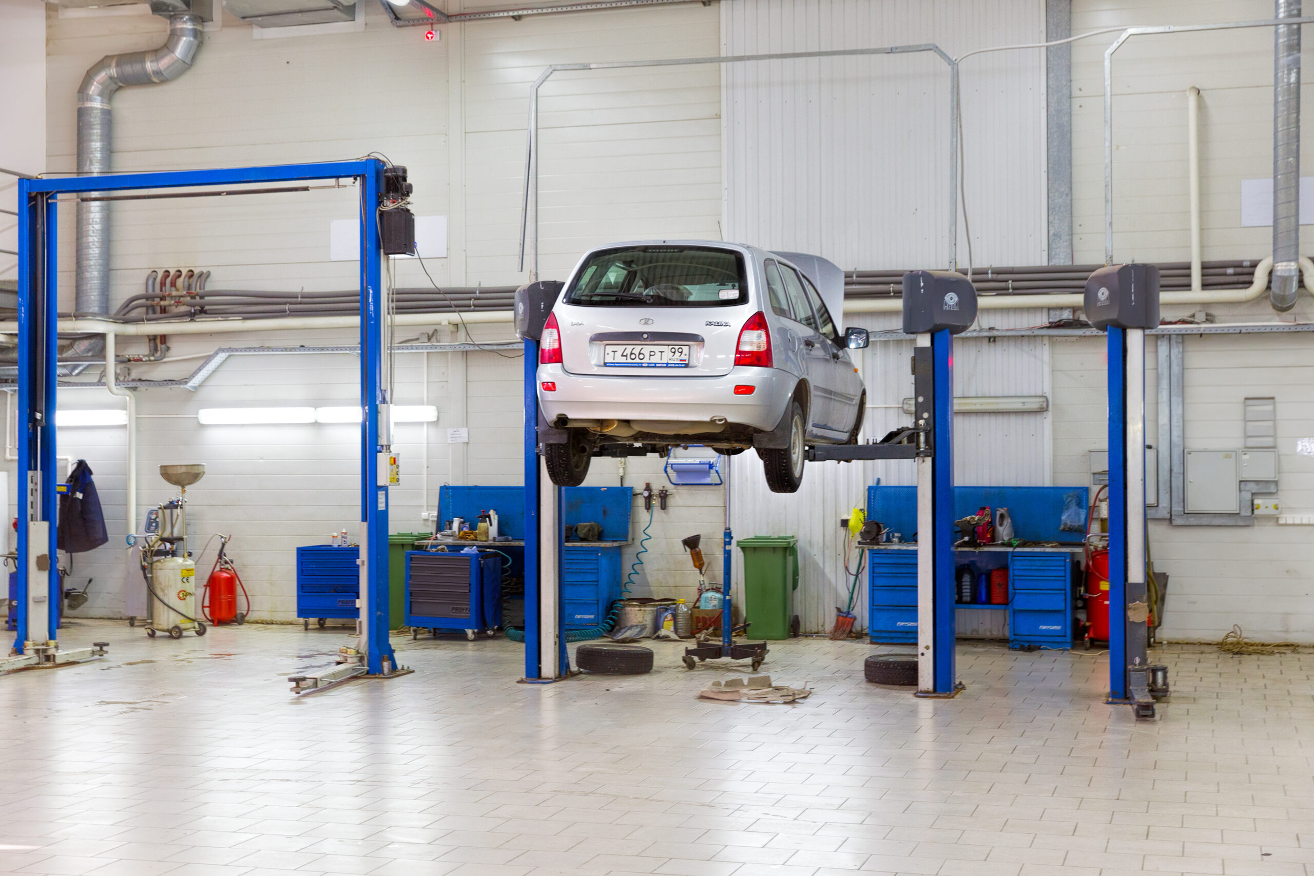technician working on efficient planning for garage door opener replacement systems