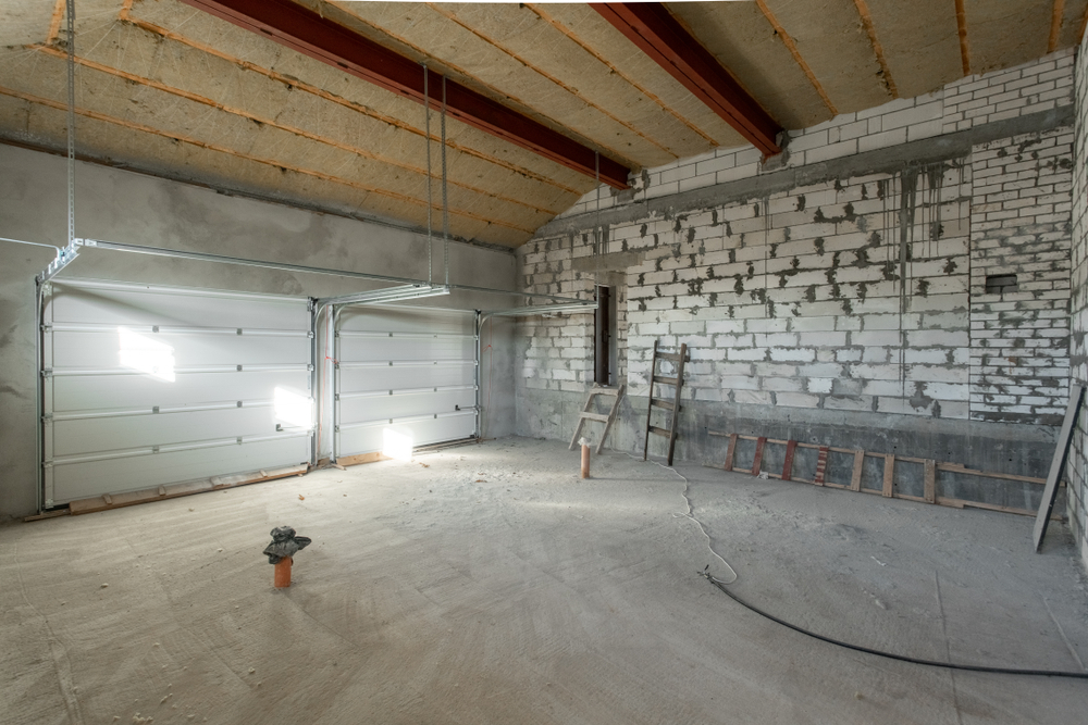 technician applying garage door repair strategies for strong steady performance