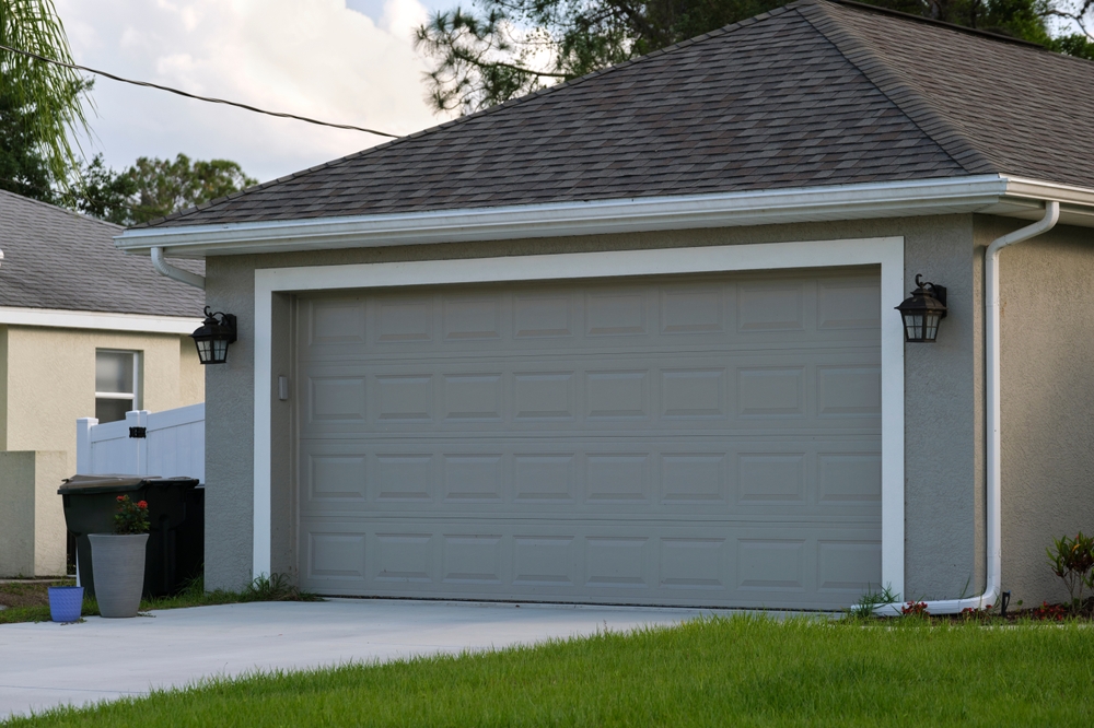 Modern home upgrading an old garage door for improved safety and curb appeal