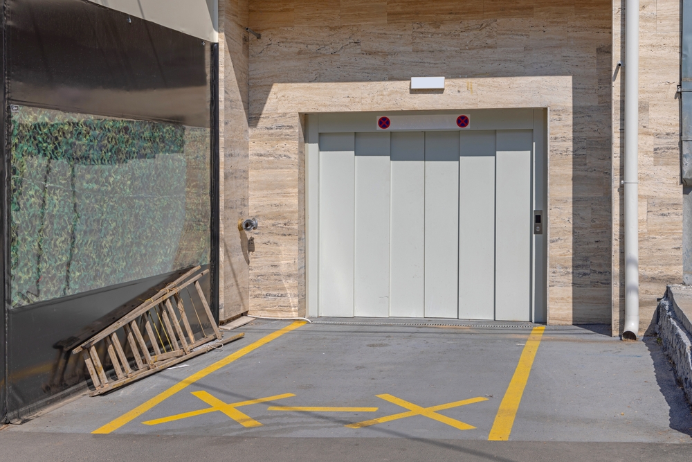 Modern home with overhead garage door installation for improved functionality and curb appeal