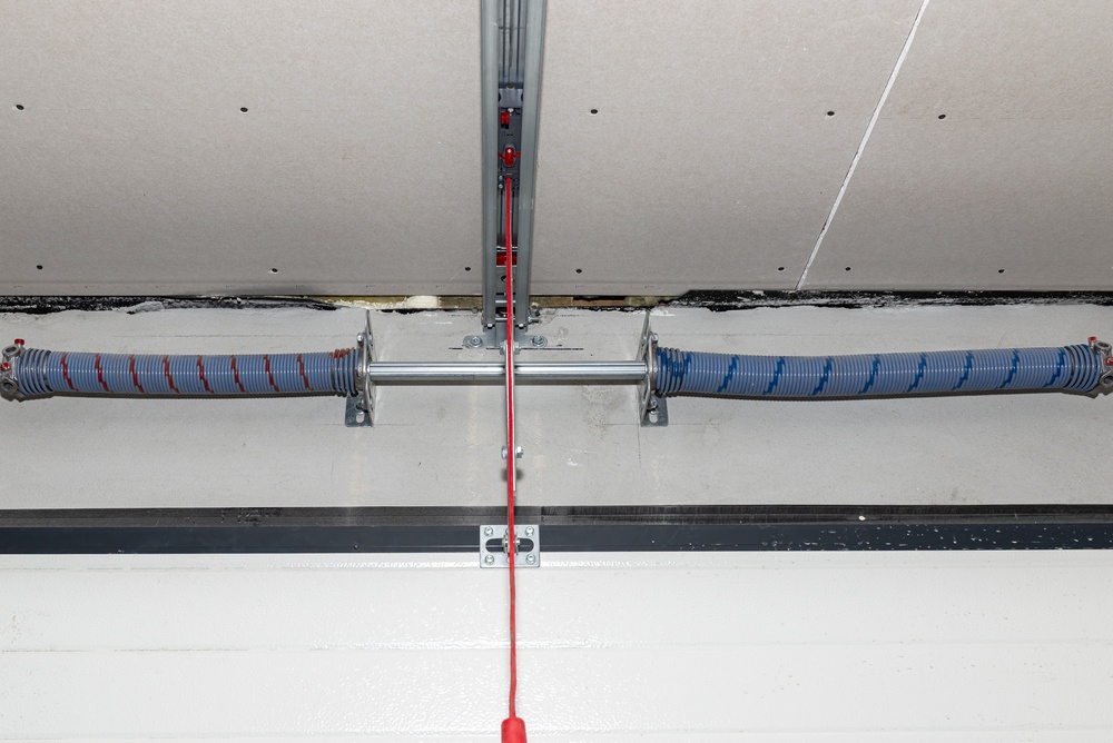 Different garage door opener types installed in a modern residential garage