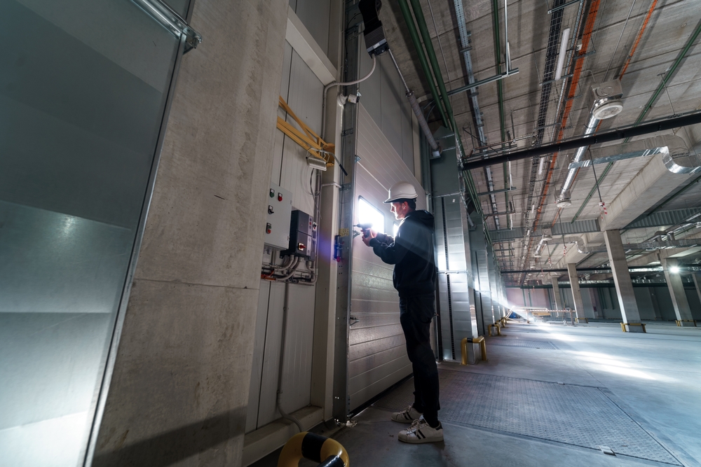 Technician explaining garage door opener replacement cost and available opener options
