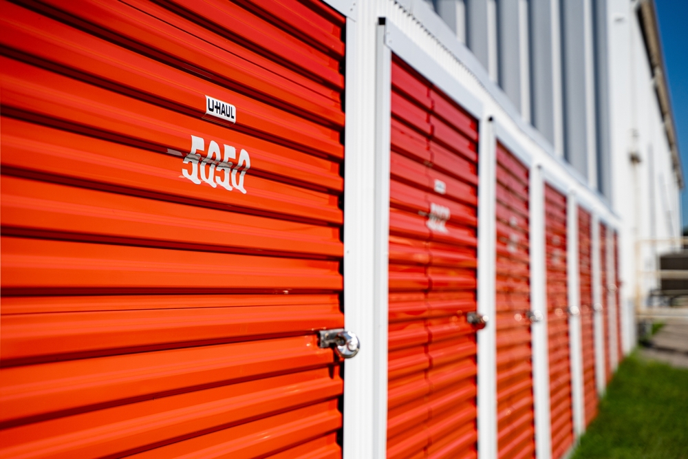 Homeowner maintaining a dark-colored garage door to prevent fading from California sun exposure