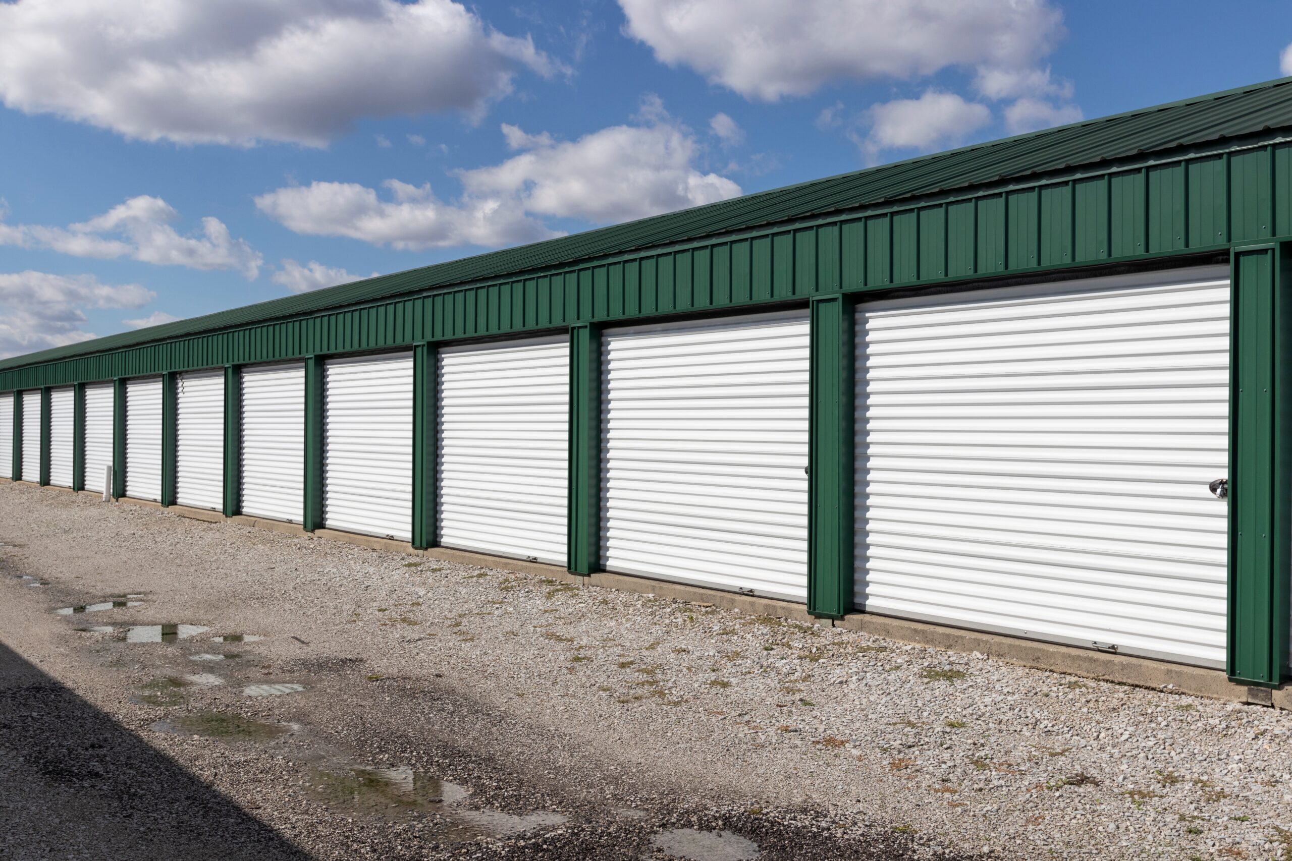 Comparison of sectional vs rolling steel commercial doors in an industrial facility
