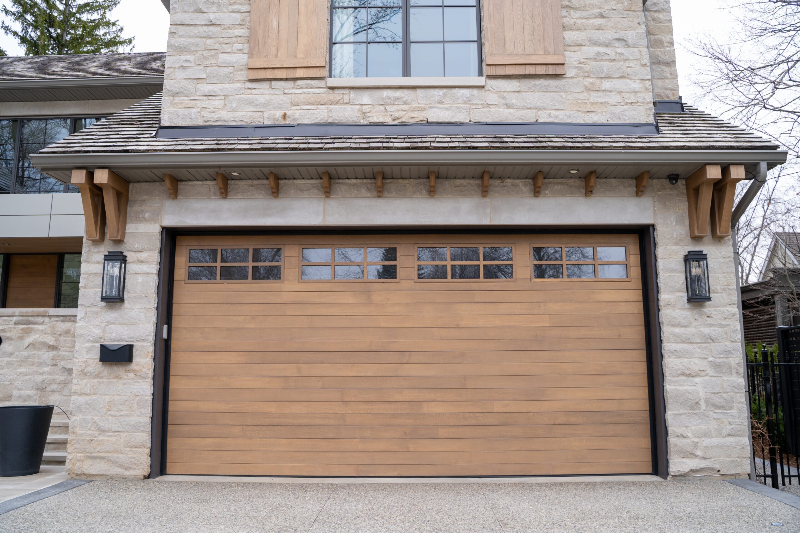 Home exterior showcasing how to match garage door to custom entry door for enhanced curb appeal