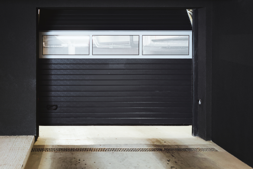 Modern home featuring a matte black garage door trend popular in 2026 home design