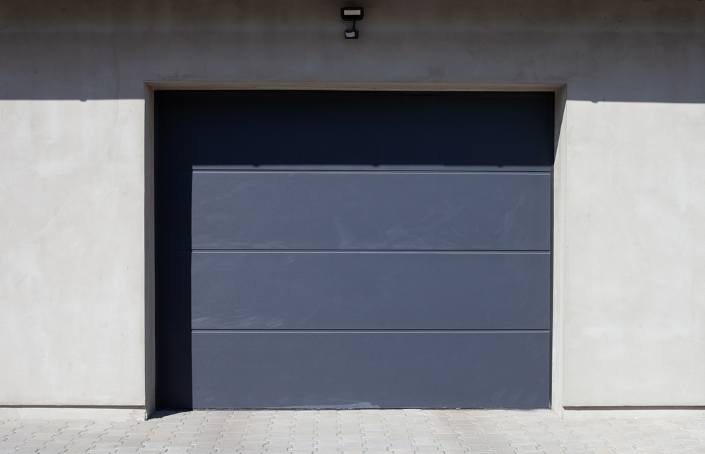 Modern garage door featuring frosted glass windows and a stylish design that enhances privacy